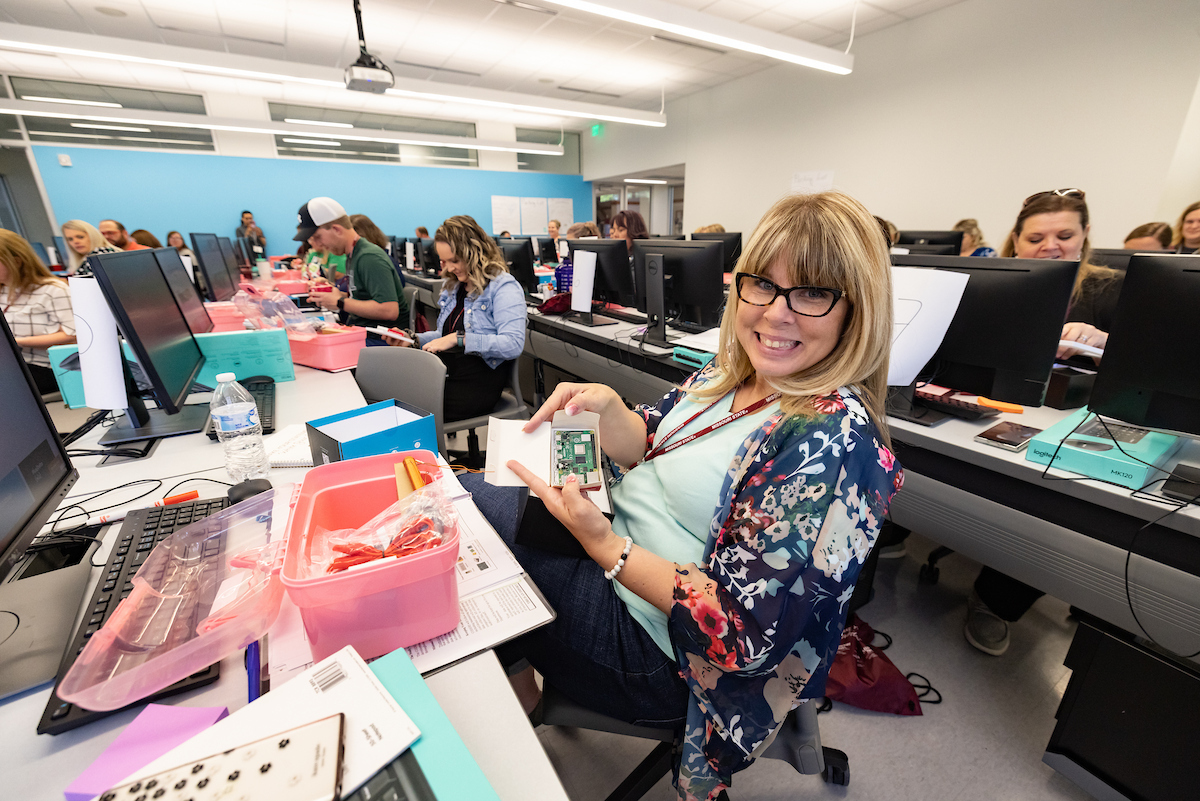 CODERS participant with coding supplies